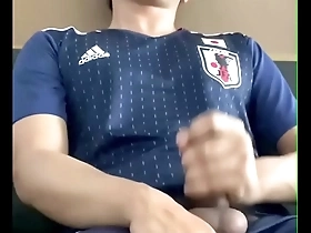 Cum shot asian guy playing with his big cock in japanese football suit