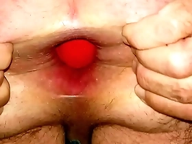 Huge 12cm wide football sliding out of my stretched ass up close while standing.